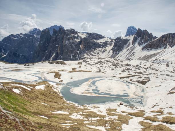 istock View Over Alpine Valley To Sharp Alps Peaks . Mountains Increased From Cloudy Background 1284003148