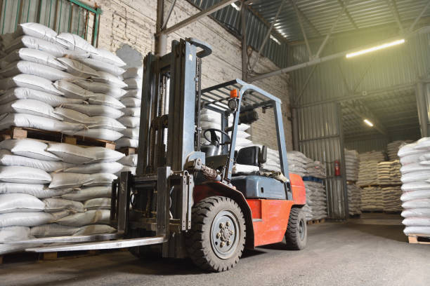 istock A forklift stands in a warehouse next to pallets with full bags 1284004733