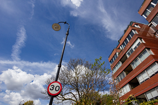 Speed Limit Sign in Borough of Camden, London. Apartments and flats as part of a residential district.