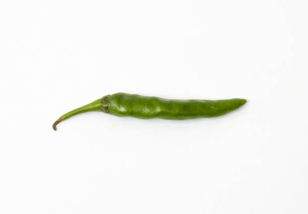 istock Isolated green chili close up on white background 1284005197