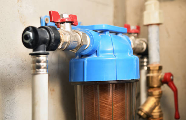 istock Plastic 10 Inch Single Water Filter, Wall Mounted Water Purifier Body Mounted On A Concrete Wall In A New Building. 1284006740