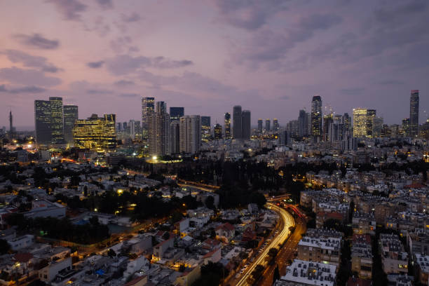 istock Modern office building downtown cityscape skyscraper skyline aerial view night 1284009411