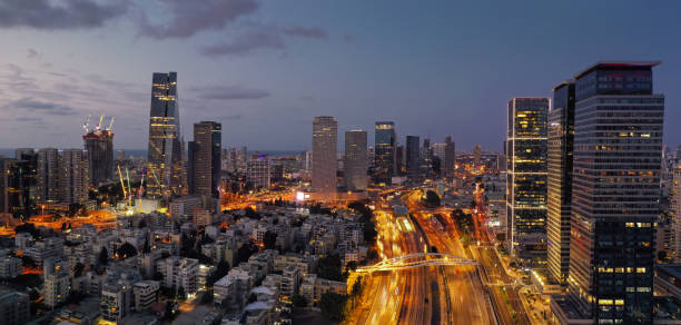 istock Modern office building downtown cityscape skyscraper skyline aerial view night 1284010082