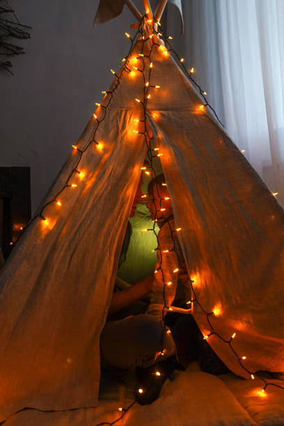 istock Magic tent with garland home, people inside. 1284011471