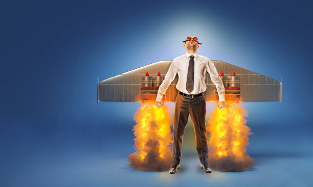 businessman with wings and flares on his back with flames and smoke. businessman with wings and flares on his back with flames and smoke. concept of aspirations and success. start up. rocket booster photos stock pictures, royalty-free photos & images