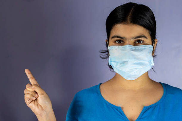 istock Indian woman wearing nose mask 1284014480