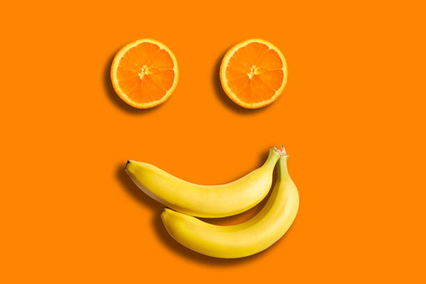 istock Orange slices and bananas making a smiley face, studio shot 1284014650