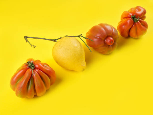 istock Ugly fruit and vegetables on yellow background 1284015816