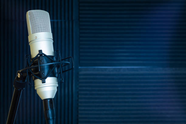 istock condenser microphone in recording studio. music background 1284016012