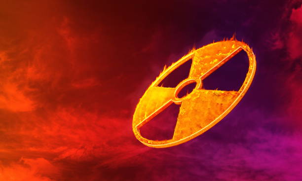 istock burning hazard sign on dark red sky background 1284016099