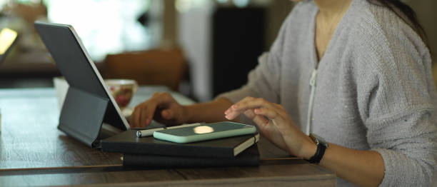 istock Female freelancer working with digital tablet, notebook and smartphone 1284019552