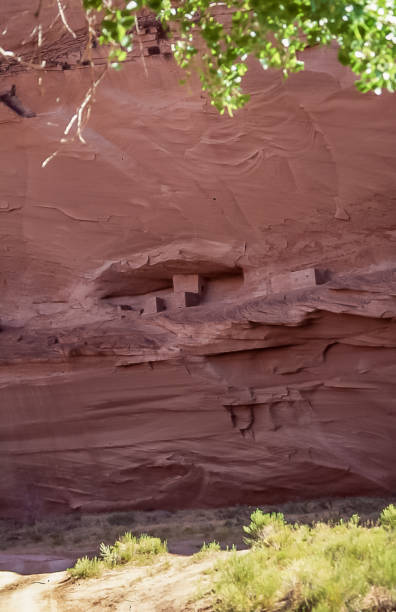 Pueblos villages of the Anasazi natives in Chelly Canyon. The remains of Anasazi people's villages can be seen in the cracks in the vertical walls that form Chelly Canyon on the Navajo Reservation in Arizona. chinle arizona stock pictures, royalty-free photos & images