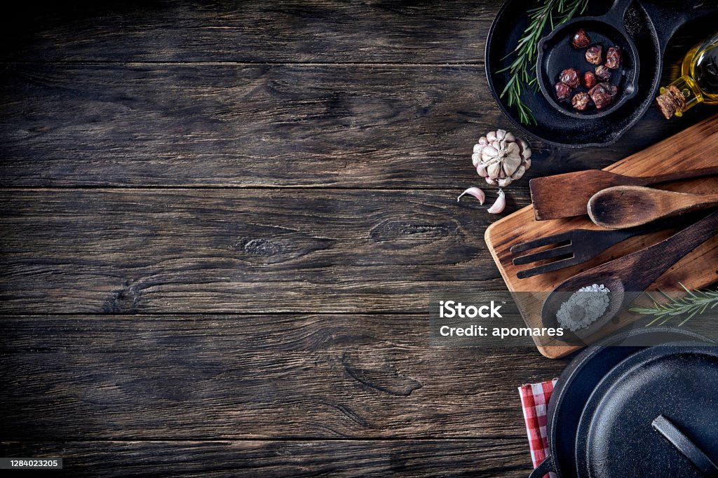 Top view of kitchen utensils on rustic table with copy space. Top view of kitchen utensils on rustic table with copy space. Vintage themes Table Stock Photo