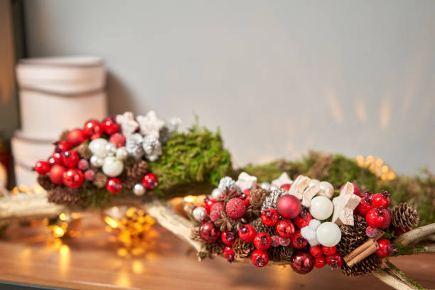 istock Closeup Christmas arrangement. Master class on making decorative ornaments. Christmas decor with their own hands. The new year celebration. Flower shop 1284023331