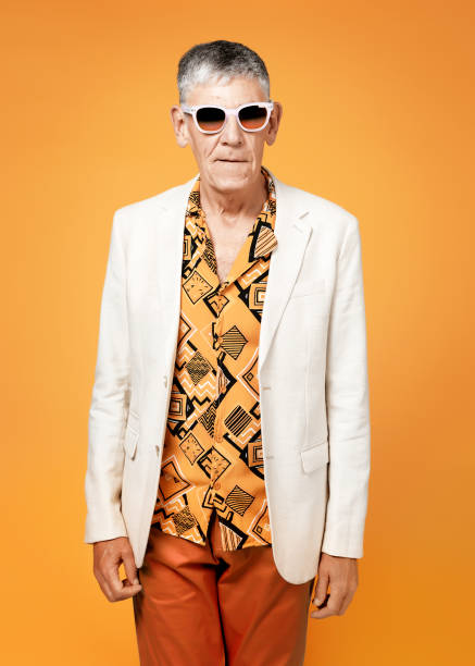 istock Serious senior man posing on colourful background 1284024737