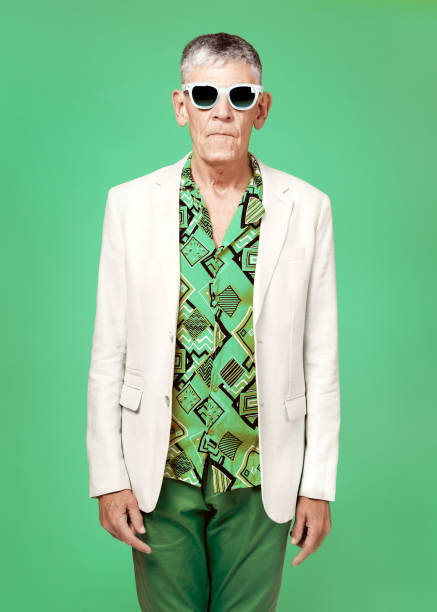 istock Serious senior man posing on colourful background 1284024760