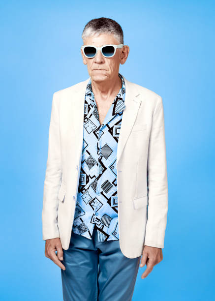 istock Serious senior man posing on colourful background 1284024761