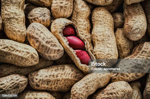 Background Of A Large Group Of Peanuts Stock Photo - Download Image Now - Peanut - Food, Abundance, Backgrounds