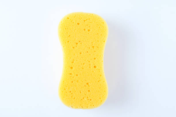 istock Foam yellow sponge for washing on white background. 1284026969