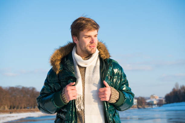 istock Walking snowy nature background. Man enjoy january outdoors. Recreation concept. Active leisure. Man traveling in winter. Warm clothes for cold season. Winter fashion. Winter holidays. Active rest 1284027335