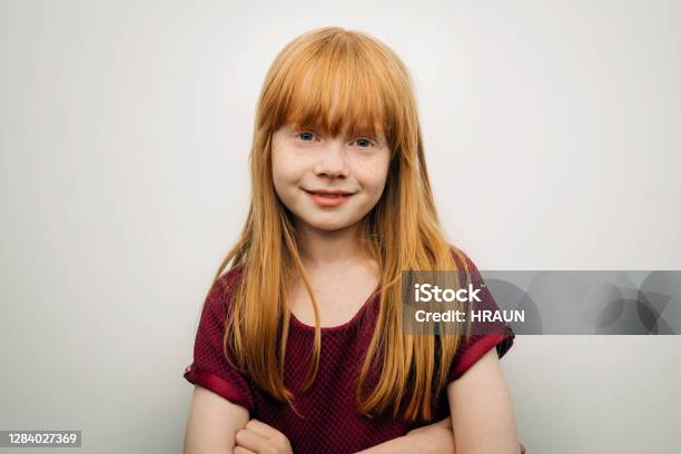 Cute Smiling Girl Standing With Arms Crossed Stock Photo - Download Image Now - Child, Girls, Portrait
