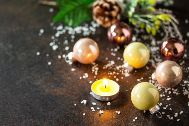 istock Christmas composition. Christmas glossy ball and a candle. 1284027532