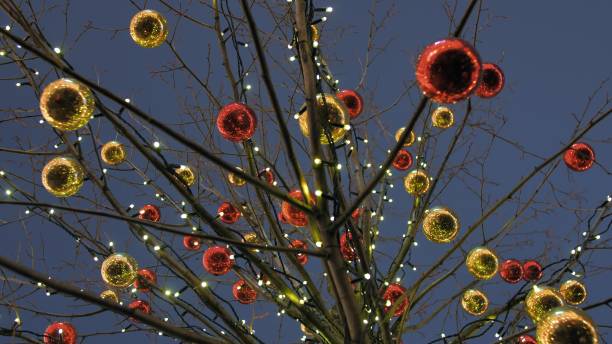 istock Christmas balls on a tree in the city 1284027680