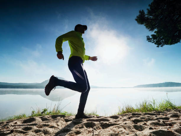 istock Outddor run. Healthy lifestyle man doing morning training 1284032857