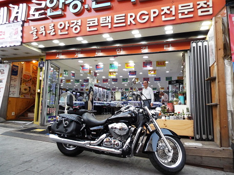 Seoul, South Korea, October 6, 2016: A motorcycle next to a business in the Namdaemun market. Seoul