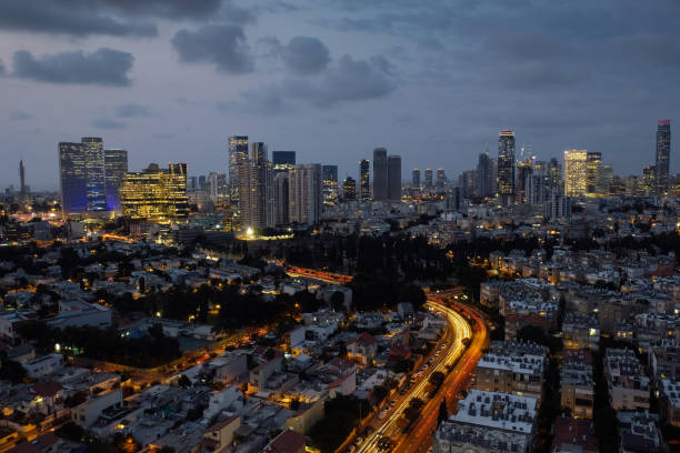 istock Modern office building downtown cityscape skyscraper skyline aerial view night 1284033879