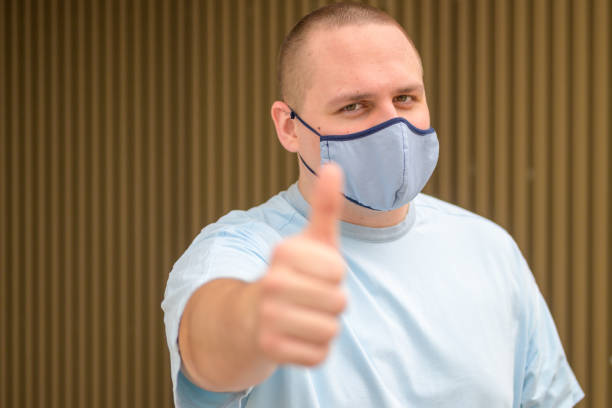 istock Upbeat positive young man giving thumbs up gesture 1284036962