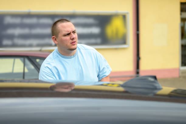 istock Serious intense young man in a parking lot 1284037298