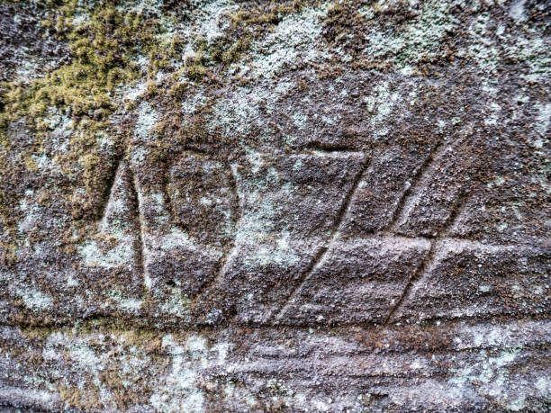 istock The year 1974 engraved into the sandstone rock. 1284038300