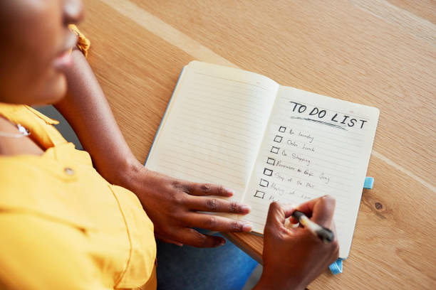 I'm sure I'll have all the boxes checked by tonight Cropped shot of an unrecognizable woman checking off boxes on her to-do list task stock pictures, royalty-free photos & images