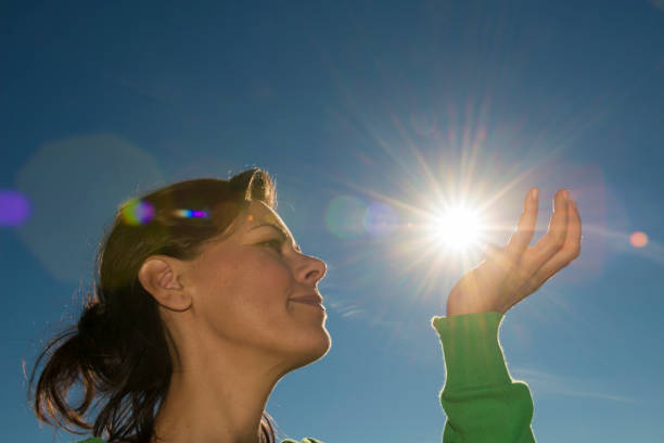 istock Woman Holding Up the Sun 1284038816