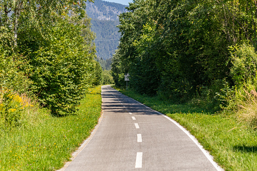 Particular view of the Ciclovia Alpeadria cycle path during summer season, Malborghetto, FVG region, Italy.