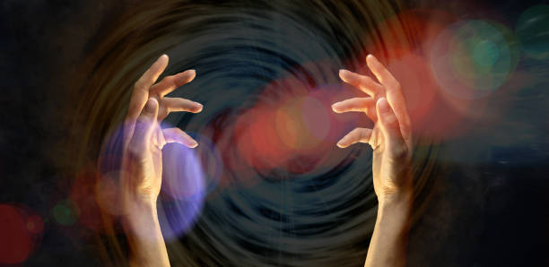 istock Two female hands opposite each other, radiating magical light. The concept of divination, mysticism, prediction of the future.Elements of this image are provided by NASA. Banner, star background. 1284040554