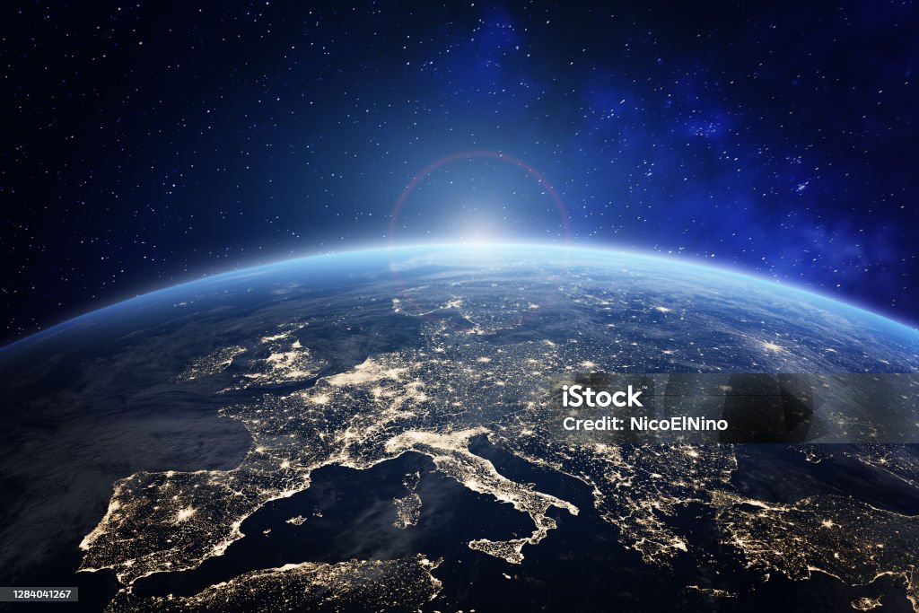 Planet Earth viewed from space with city lights in Europe. World with sunrise. Conceptual image for global business or European communication technology, elements from NASA Globe - Navigational Equipment Stock Photo