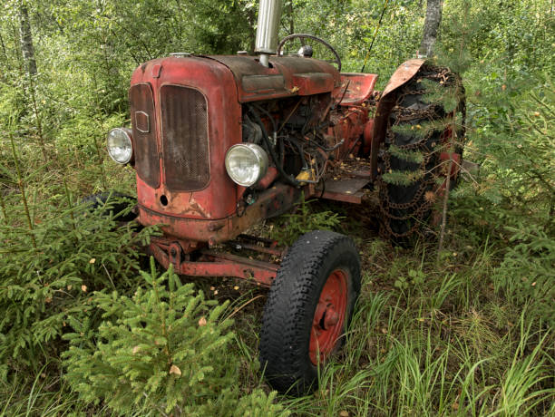 istock A rusty old disused tractor in woodland. 1284041717