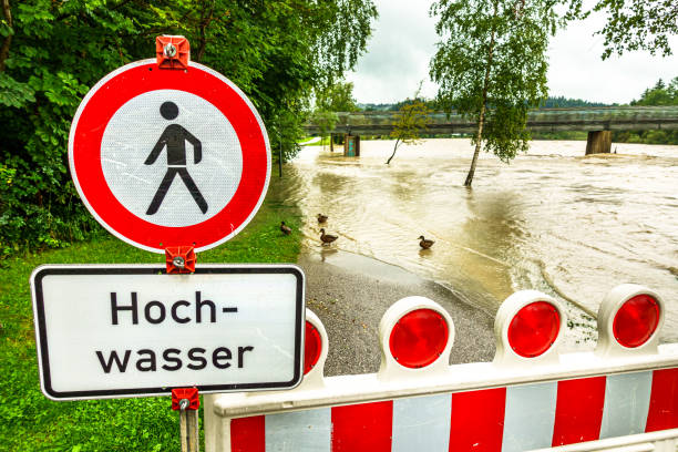 Flood sign on a road under water near the Lismore, NSW, central business district