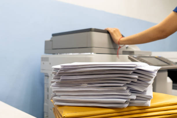 istock The papers stacked waiting to be copied with a copier machine. 1284045904