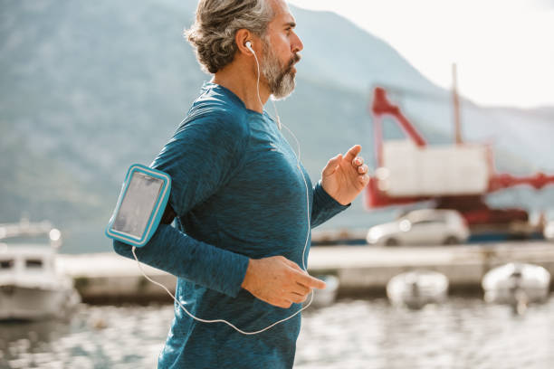 istock Active senior man jogging on a sunny day 1284050682