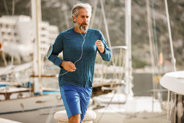 istock Active senior man jogging on a sunny day 1284050777
