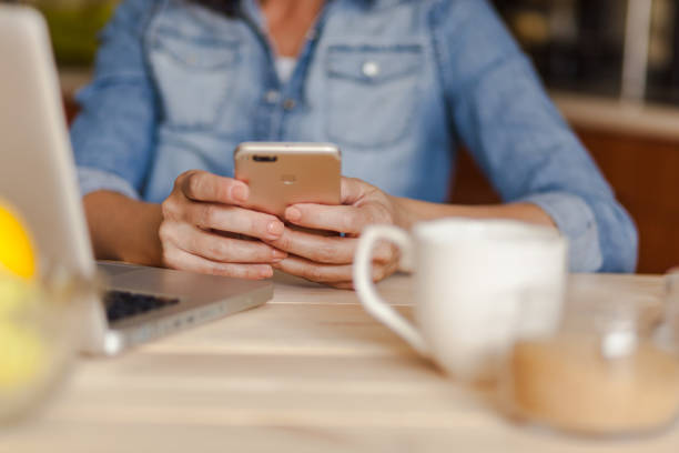 istock Close up of unrecognizable woman using cell phone. 1284052757