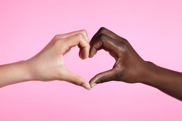 Diverse hands with love sign Diverse hands with love sign on pink background heart hands multicultural women stock pictures, royalty-free photos & images