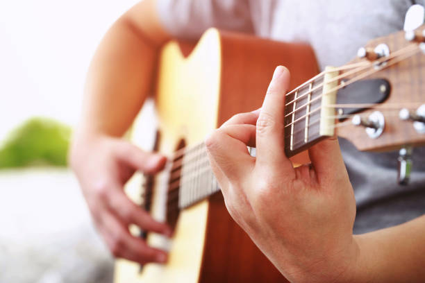 istock The musician plays guitar at the restaurant. 1284057274