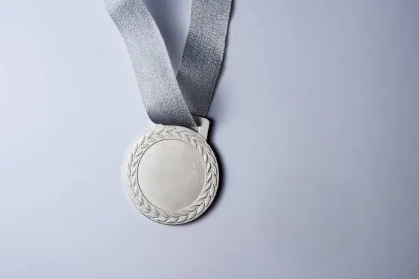 Photo of silver medal on white background