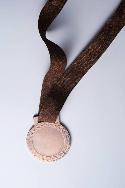 istock bronze medal on the white background 1284059109
