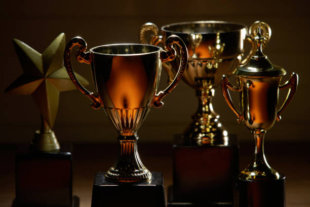 istock group of trophies on the wood background 1284059332