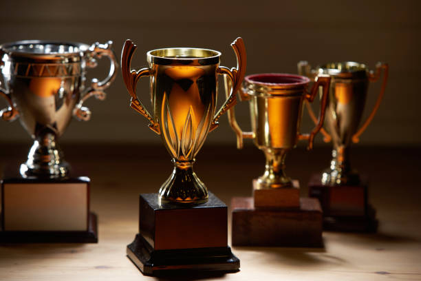 istock group of trophies on the wood background 1284060106